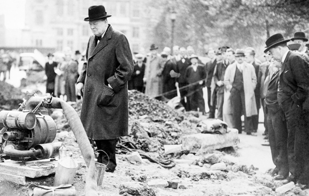 Winston Churchill surveys the damage after a German bombing raid