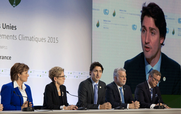Justin Trudeau speaks at the Paris climate talks - flanked by Canadian premiers (Province of BC/Flickr)