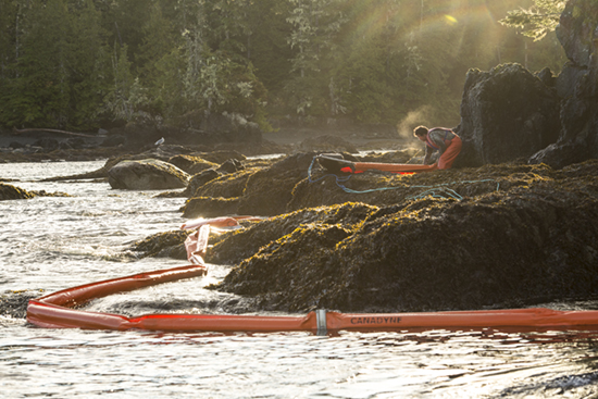 One pof many Heiltsuk responders who have remained on the scene for weeks, working on the spill that threatens their waters and seafood harvesting (Photo: Tavish Campbell)