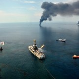 Clean-up crews scramble early on to deal with the blow-out of BP's Deepwater Horizon oil well in the Gulf of Mexico - photo Carolyn Cole/LA Times