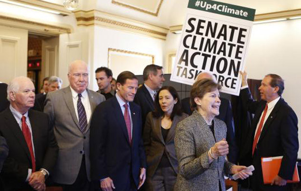 U.S. Senators from the Senate Climate Action Task Force urge action on climate change in Washington (Photo: Yuri Gripas, Reuters).