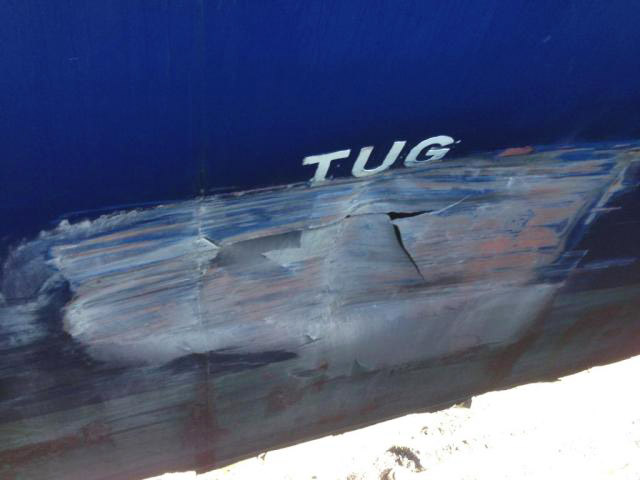 The CMA CGM Attila's damaged hull, after striking the dock at Vancouver's Centerm port (cell phone image)
