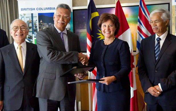 Ex-Petronas CEO Shamsul Abbas shaking hands with BC Premier Christy Clark in 2014 (BC gov photo)